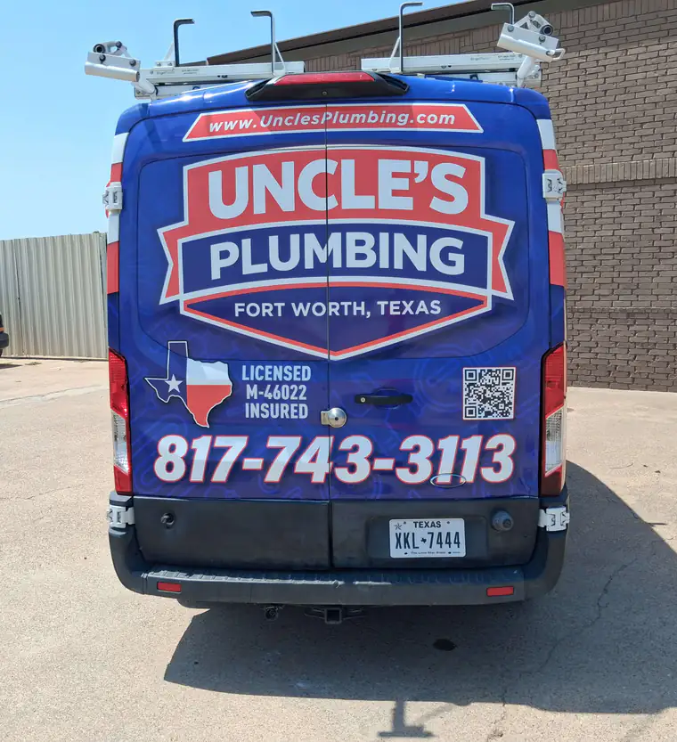 Rear doors of an Uncle's Plumbing van showing Licensed M-46022 and Insured lettering